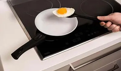 An egg frying without oil in a P600 pan