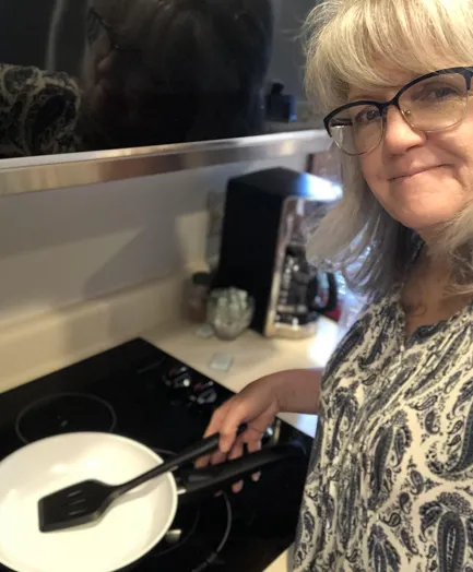 Valerie S. at her stove
