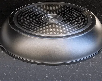 The base of the P600 pan after the car drove over it, with no damage