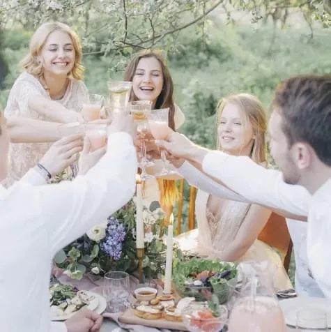 Friends toasting at a dinner table