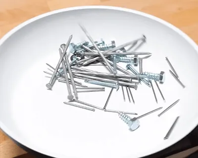 A pile of nuts and bolts shaken around inside the P600 ceramic pan